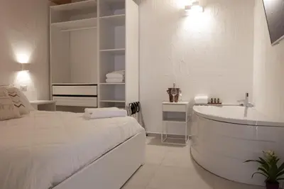 Letto o letti in una camera di Guest House Sciola - TS ROOMS B&B