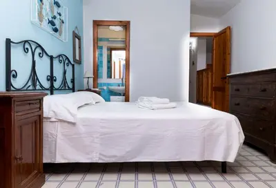 Letto o letti in una camera di Villa Olivastro