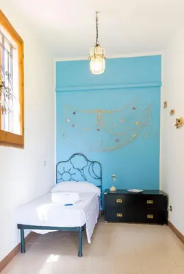 Letto o letti in una camera di Villa Olivastro