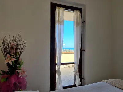 Letto o letti in una camera di Amazing view apartment close to the beach Costa Rei