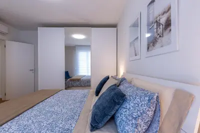 Letto o letti in una camera di Colombo Palace - viale colombo 358