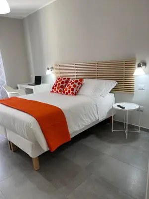 Letto o letti in una camera di ViaRiva Rooms