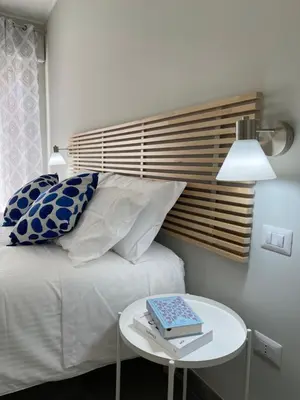 Letto o letti in una camera di ViaRiva Rooms