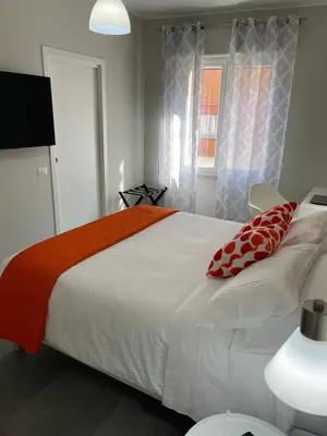 Letto o letti in una camera di ViaRiva Rooms