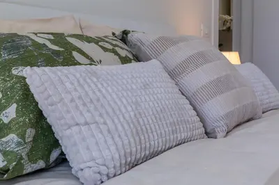 Letto o letti in una camera di Colombo palace - suite eden via perda bona 35a