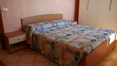 Letto o letti in una camera di Appartamento vista mare Posidonia