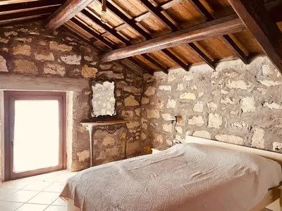 Letto o letti in una camera di Casa di Pietra