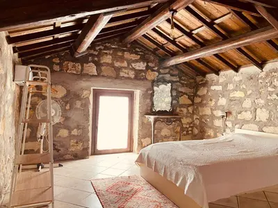 Letto o letti in una camera di Casa di Pietra