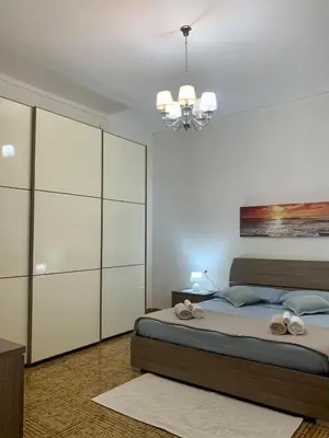 Letto o letti in una camera di Apt con portico privato vicino Cagliari Airport