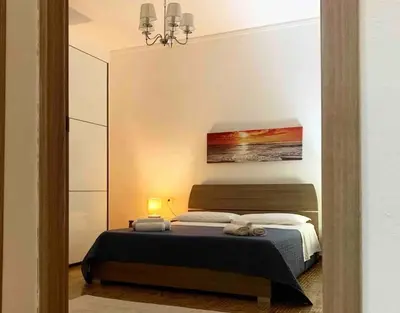 Letto o letti in una camera di Apt con portico privato vicino Cagliari Airport