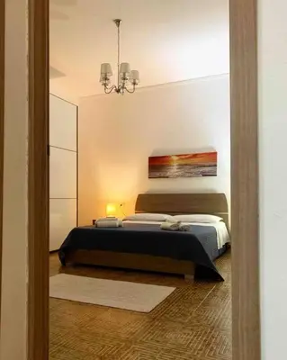 Letto o letti in una camera di Apt con portico privato vicino Cagliari Airport