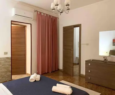 Letto o letti in una camera di Apt con portico privato vicino Cagliari Airport