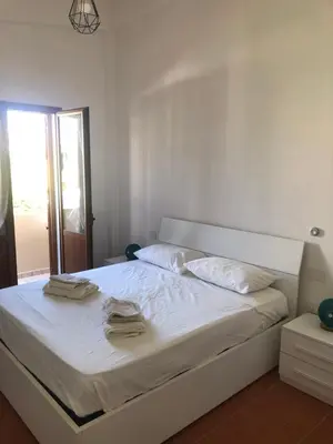Letto o letti in una camera di Fausthome Sant'Antioco