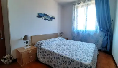 Letto o letti in una camera di Home & Sea Villasimius