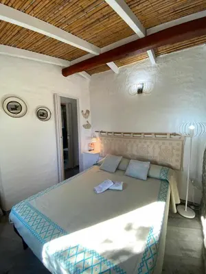 Letto o letti in una camera di Sa Domu De Orrì al Mare