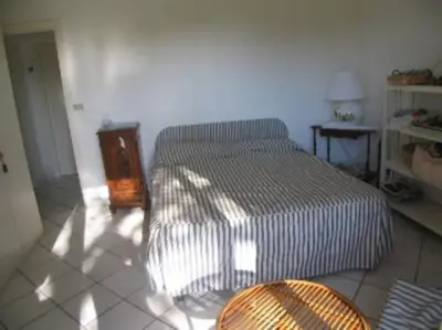 Letto o letti in una camera di Villa Aurelia, 70m from the sea