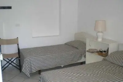 Letto o letti in una camera di Villa Aurelia, 70m from the sea