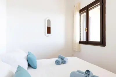 Letto o letti in una camera di Fronte Mare Pinus Village 74