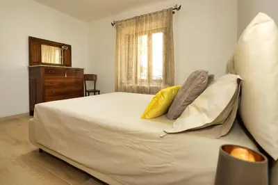Letto o letti in una camera di Casa di Nonna Rosa e Nonno Ciccito