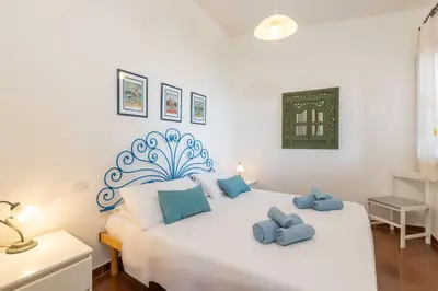 Letto o letti in una camera di Fronte Mare Pinus Village 76