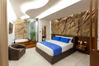 Letto o letti in una camera di Palazzo Ferrucci Luxury Suites