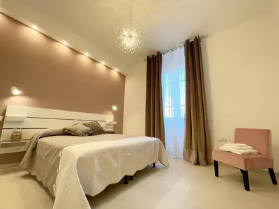 Letto o letti in una camera di XOXO Cagliari