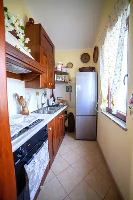 Cucina o angolo cottura di Villa Ottavio - SHARDANAPARTMENTS
