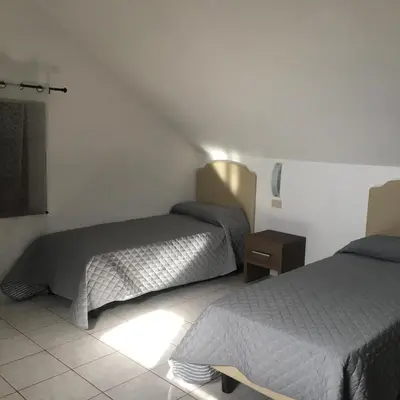 Letto o letti in una camera di Appartamento Villanova