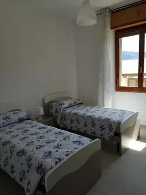 Letto o letti in una camera di Da zia Mariuccia