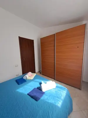 Letto o letti in una camera di Un Gioiellino a Costa Rei Centro - Al mare a piedi