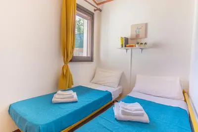 Letto o letti in una camera di [COSTA REI] *500 metri dal mare* Free Parking/Wifi