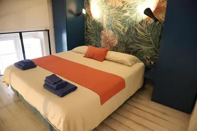 Letto o letti in una camera di Open Suite Cobalto