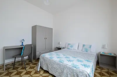 Letto o letti in una camera di Casa Hibiscus Villasimius