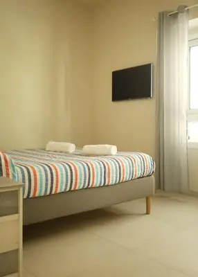 Letto o letti in una camera di Boedo Apartments