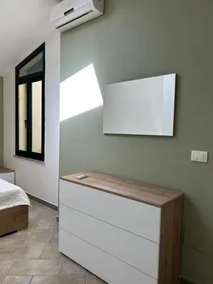TV o dispositivi per l'intrattenimento presso Appartamento vicino spiaggia