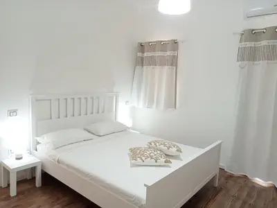 Letto o letti in una camera di Casa Vacanze La Stella di Capo Blu