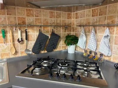 Cucina o angolo cottura di Lovely home 5 min walk to the beach, 3 bedrooms ample outdoor relax and WIFI