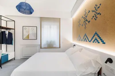 Letto o letti in una camera di tèmporas Design Rooms