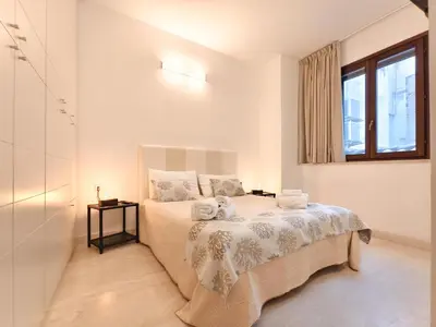Letto o letti in una camera di Oidu - Cagliari Suites