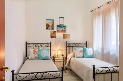 Letto o letti in una camera di Donatello Home stay - Villasimius