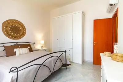 Letto o letti in una camera di Donatello Home stay - Villasimius