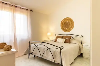 Letto o letti in una camera di Donatello Home stay - Villasimius