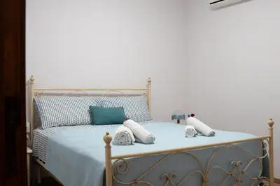Letto o letti in una camera di Villa Quattro Archi