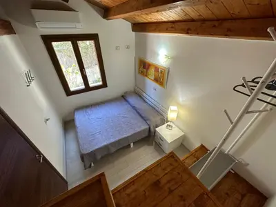 Letto o letti in una camera di Villa Ludi