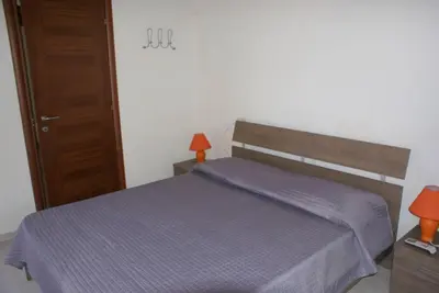 Letto o letti in una camera di Villa Ludi