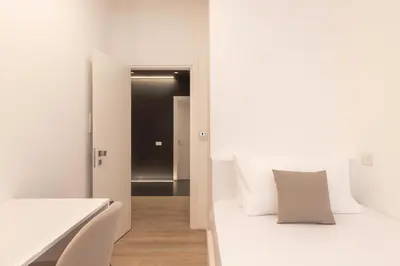Letto o letti in una camera di Metropolitan Rooms