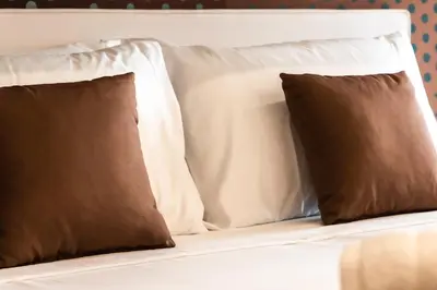 Letto o letti in una camera di Metropolitan Rooms