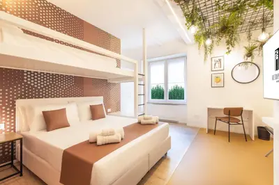 Letto o letti in una camera di Metropolitan Rooms