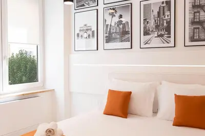 Letto o letti in una camera di Metropolitan Rooms