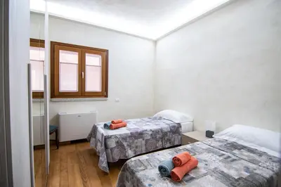 Letto o letti in una camera di Villa S'Olioni